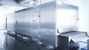 Stainless steel food processing equipment with access door hinges