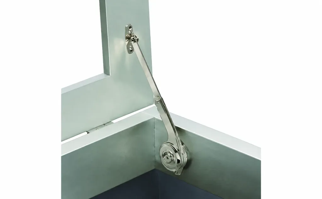 Industrial lid stay installed inside a metal enclosure
