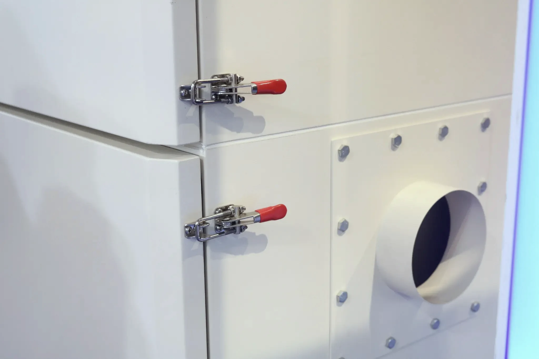Environmental chamber housing secured with over-center draw latches